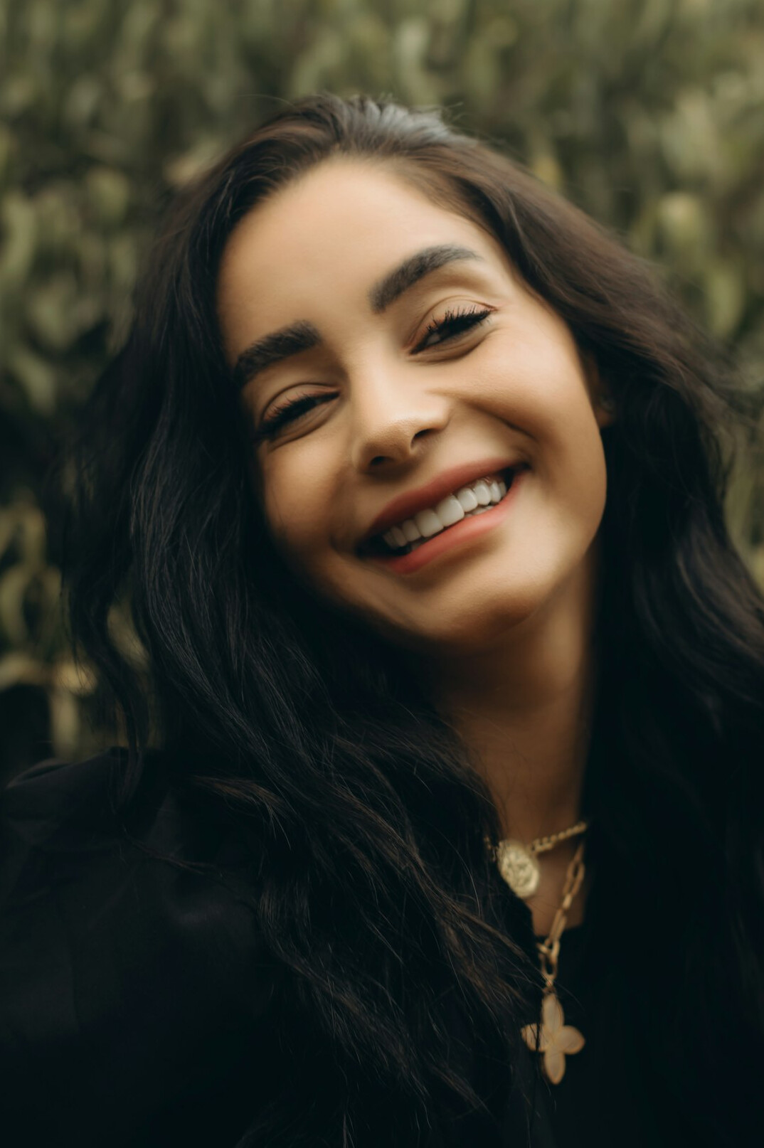 Portrait of a smiling woman with long dark hair