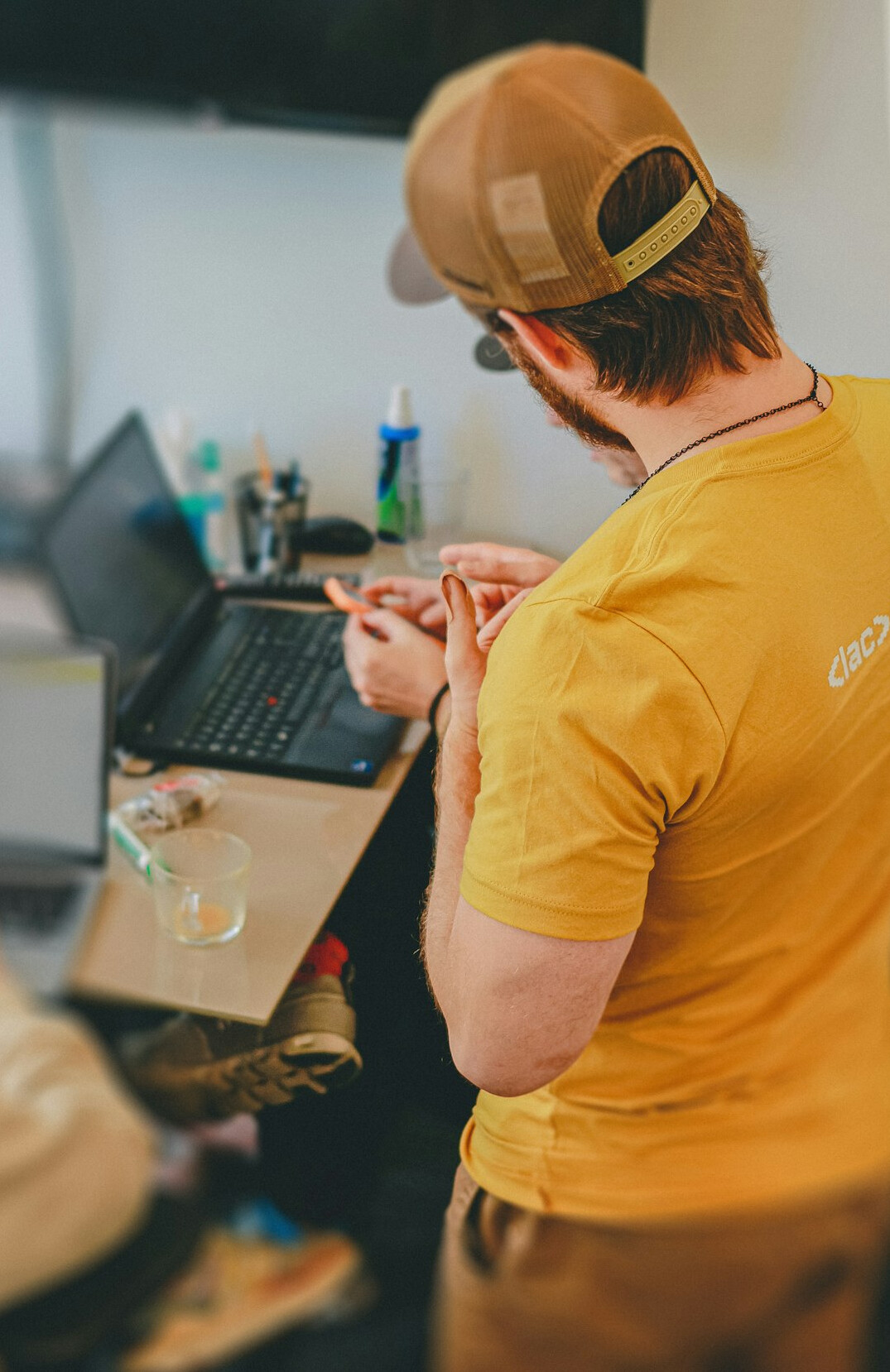 hands coding on laptop