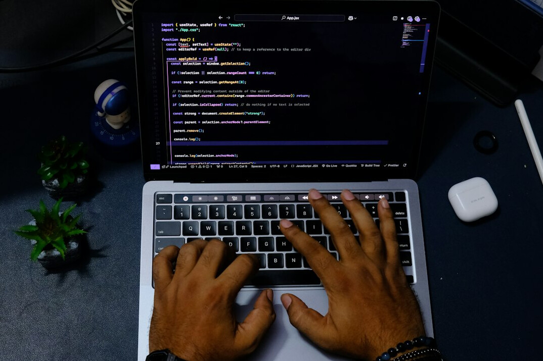 hands typing code