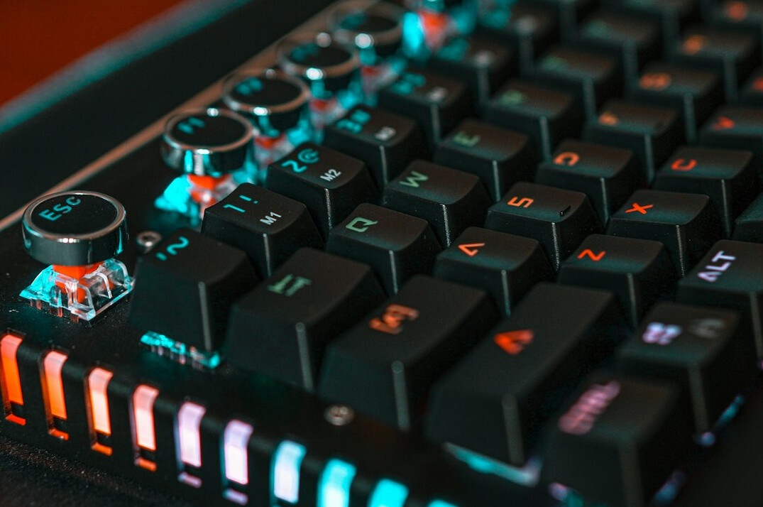 Close-up of hands typing on a mechanical keyboard