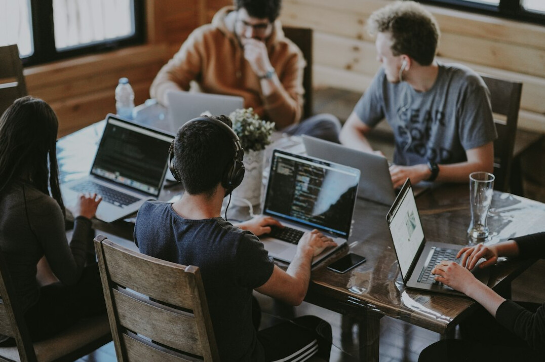 students coding together in classroom